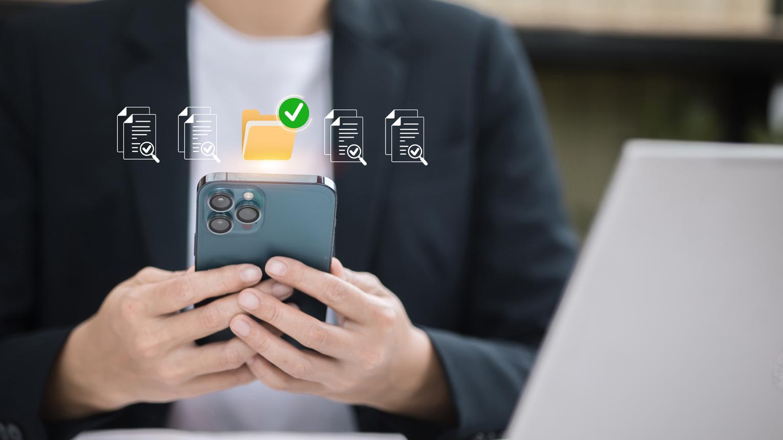 Person merging PDF files on a smartphone browser